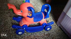 Orange And Blue Plastic Elephant Ride On Toy