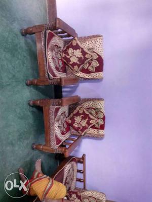 Two Brown Wooden Framed Red-brown Floral Pad Armchairs