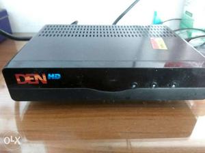 DEN HD set top box with HDMI cable, and adapter.