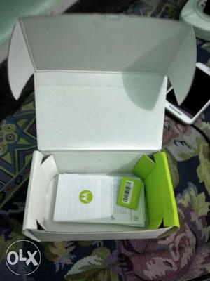 MotoX play 32 GB with charging cable with box.