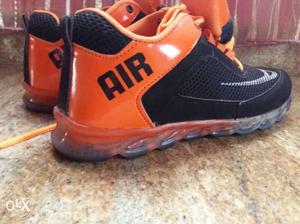 Pair Of Black-and-orange Nike Airmax