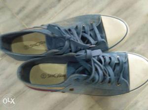 Pair Of Blue And White Low Top Shoes