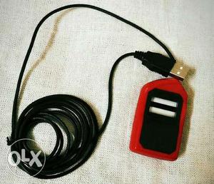 Red And Black Electronic Device With Connector