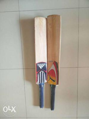 Two Brown Wooden Cricket Bats