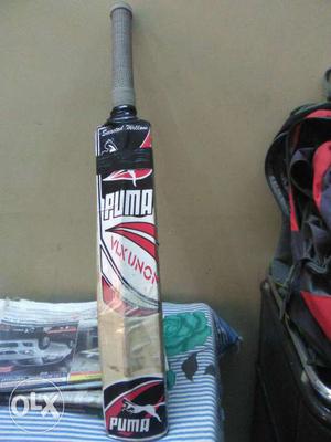 Black, White And Red Puma Vix Unon Cricket Bat