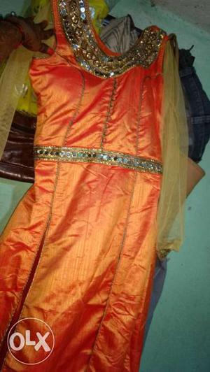 Orange and golden lahnga suit