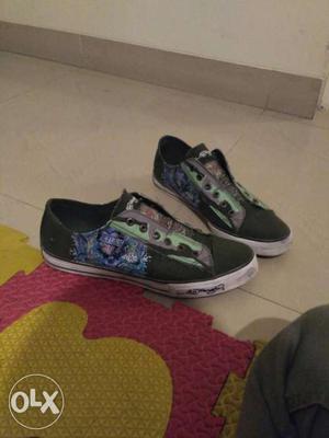 Pair Of Black-green-and-purple ED Hardy original shoes