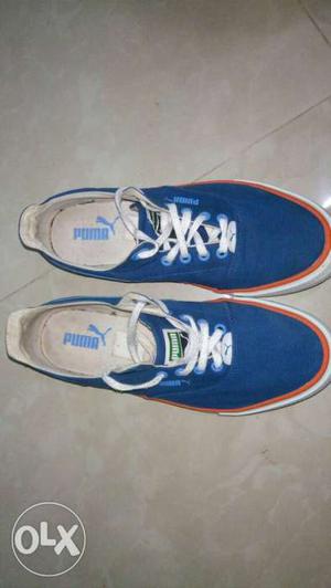Pair Of Blue Puma Low Top Sneakers