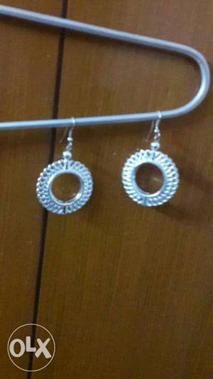 Pair Of Silver Dangling Earrings
