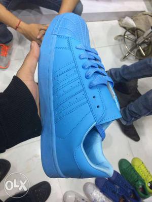 Paired Blue Adidas Sneaker