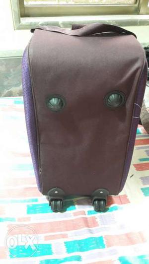 Purple And Brown Duffel Bag