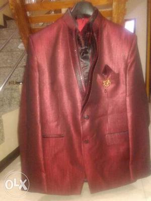 Shiny maroon colored 2 Piece unused suite,size 42.