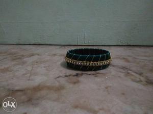 Silk thread bangle green in colour.