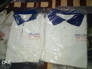 Two White-and-blue Reliance Polo Shirt