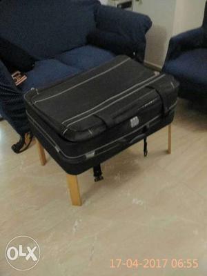 Black colour imported used Suitcase.34 In x 20 In x10 in