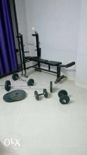 Black Bench Press And Barbell Set