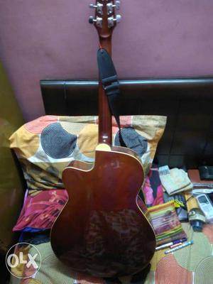 Brown acuastic guitar