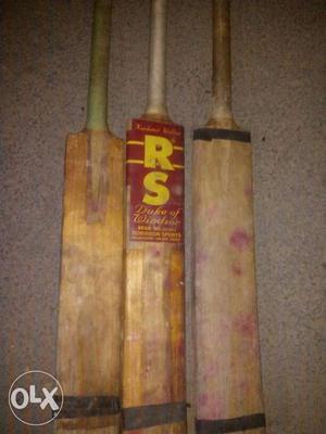 Three Brown Wooden Cricket Bats