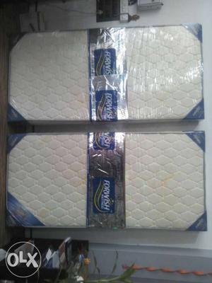 Two Beige Quilted Mattresses In Packages