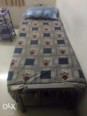 A 8 month old metal bed with 6 inch mattress