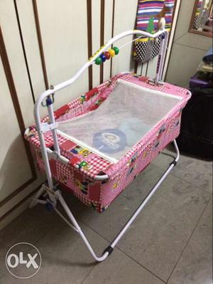 Baby's foldable Pink And White Cradle