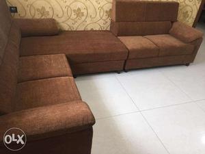 L shape Sofa with brown water proof fabric.