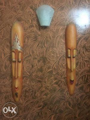 Pair of wall mounted wooden masks..