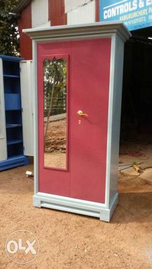 Red And White Wooden Cabinet With Mirror