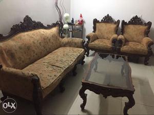 Teak wood sofa sets along with a centre table and a corner