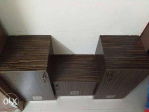 Three Brown Wooden 3-door Cabinet with various rack in