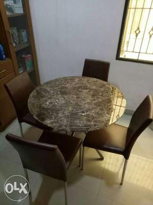 Top cream And brown Marble Table With Four leather Chairs