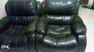 Two Black Leather Sofa Chairs