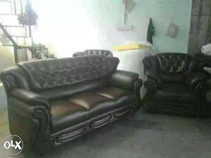 Two Black Leather Tufted Couches