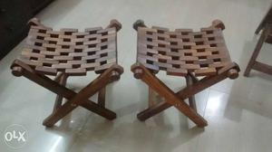 Two Brown Wooden Folding Chairs