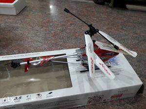 White And Red RC Helicopter On Box