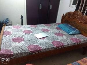 Wooden bed with mattress.size-4*6.Superb condition.