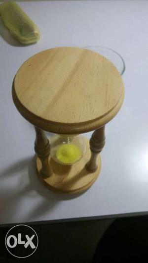 Yellow sand clock with wood structure, soothing