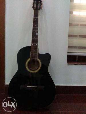 Black acoustic guitar for sale,not used much.