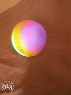 Pink, Yellow, And White Rubber Ball Toy