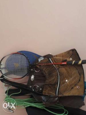 Red And Black Badminton Racket And Brown Leather Tote Bag