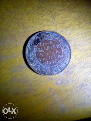 Round Blue And Brown One Quarter Anna India Coin
