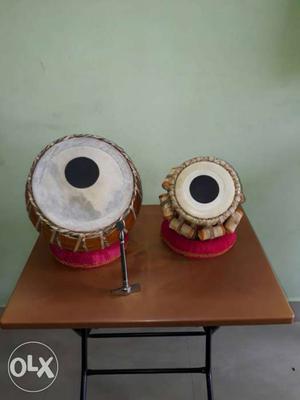 The tabla set is new & made of Neem wood. Price includes the