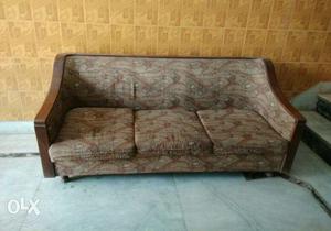 Brown Wooden Frame Base And Grey 3 Cushioned Sofa