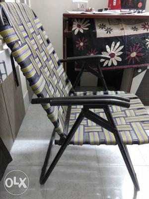 Gray, Yellow, And Black Plaid Folding Armed Chair