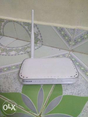Netgear router with Adapter it's new but not in