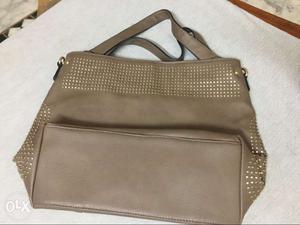 Newly purse brown in color