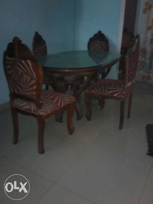 Oblong Brown Wooden Table And Four Chairs Dining Set