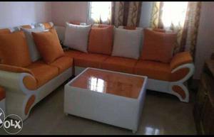 Orange And White Sectional Couch With Throw Pillows