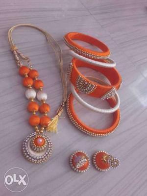 Orange-and-white Jhumka Pendant Necklace Set