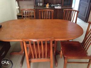 Oval shaped 6 chair dining table